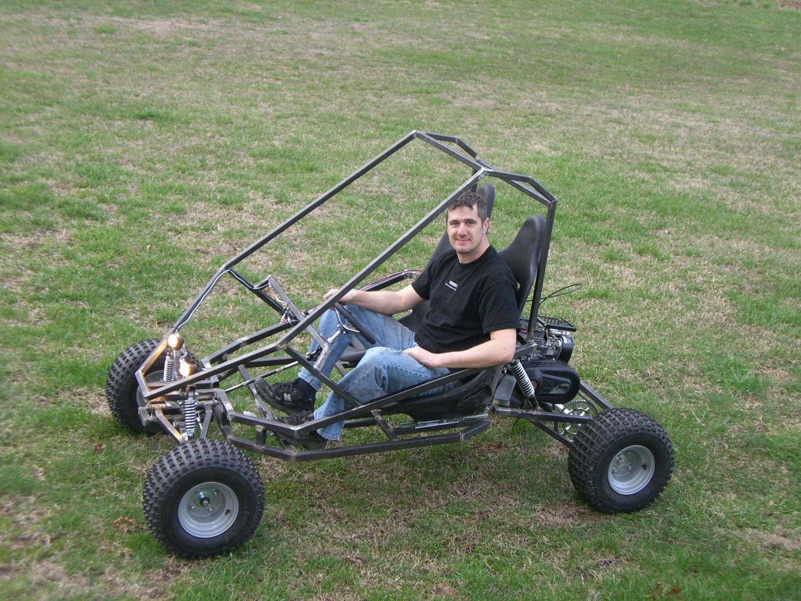 Rider in roll-cage frame